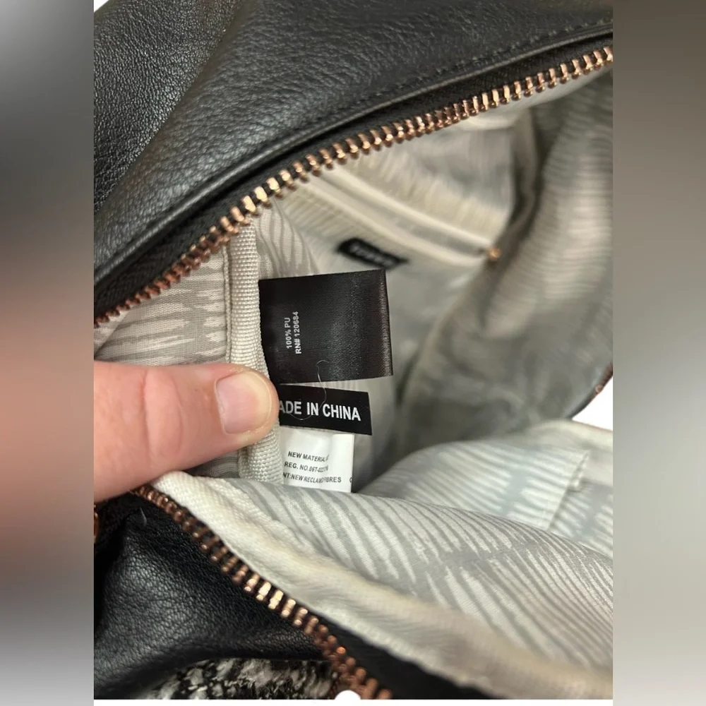Torrid Elegant Black Faux Leather Backpack With Boucle Sweater Front Pocket